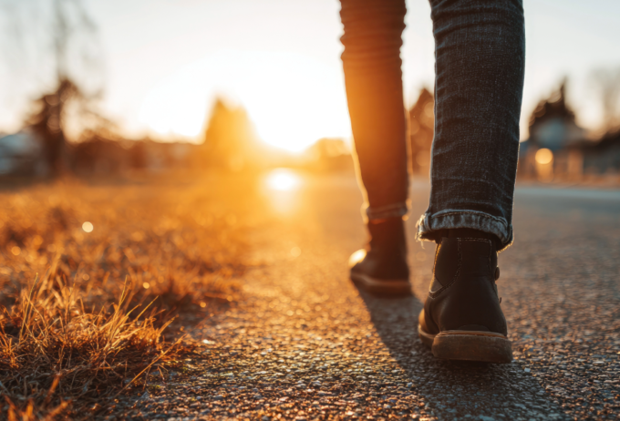 Close up of legs and feet, walking along a path.