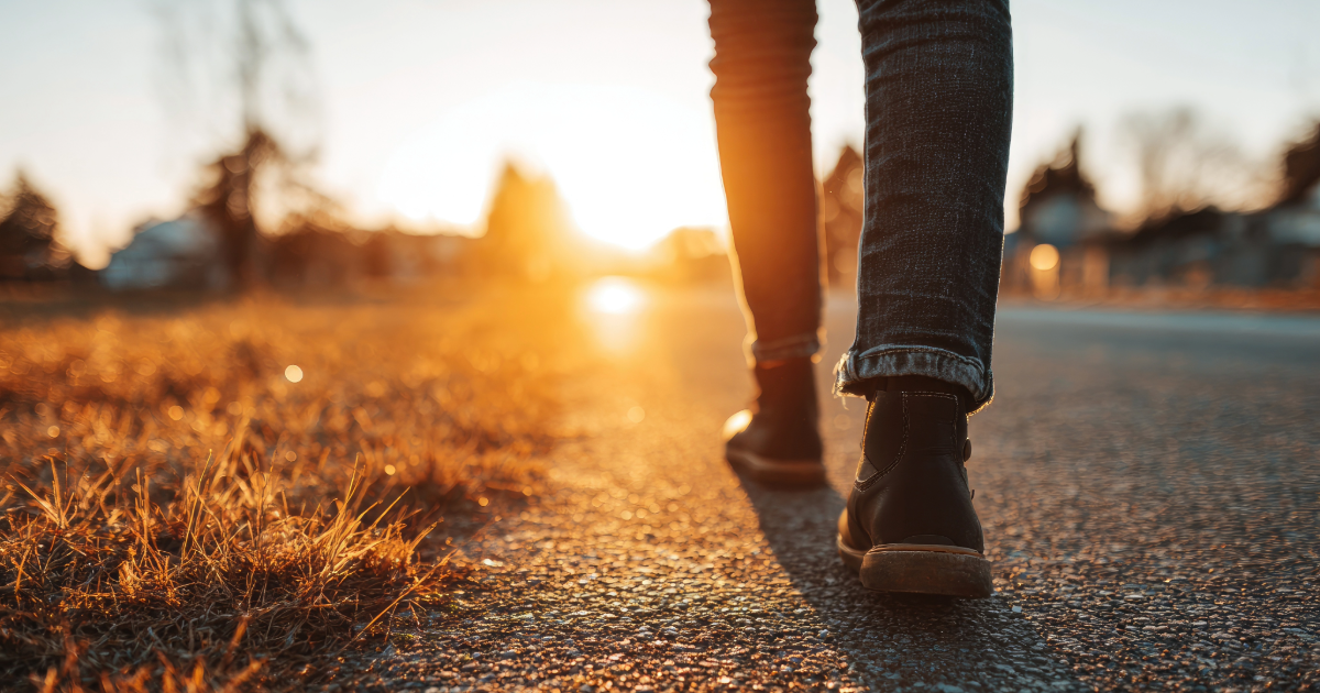 Close up of legs and feet, walking along a path.