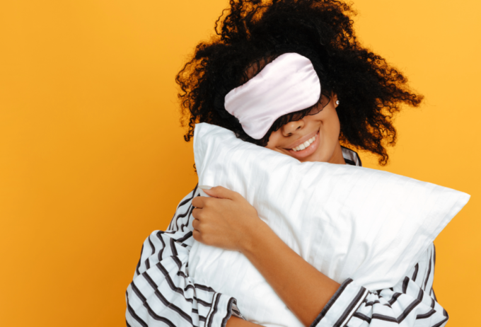 Woman with eye mask in pyjamas