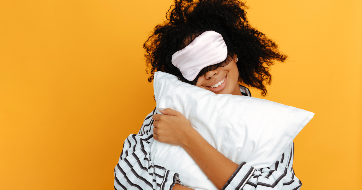 Woman with eye mask in pyjamas